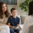 Mother and son talking with a pediatrician during an ADHD evaluation visit in Newport Beach