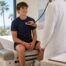 Pediatrician listening to a teen athlete’s heart with a stethoscope during a sports physical in Newport Beach